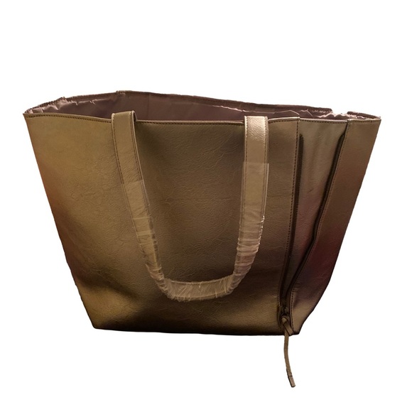 Neiman Marcus Handbags - Neiman Marcus NWOT gold expandable tote.